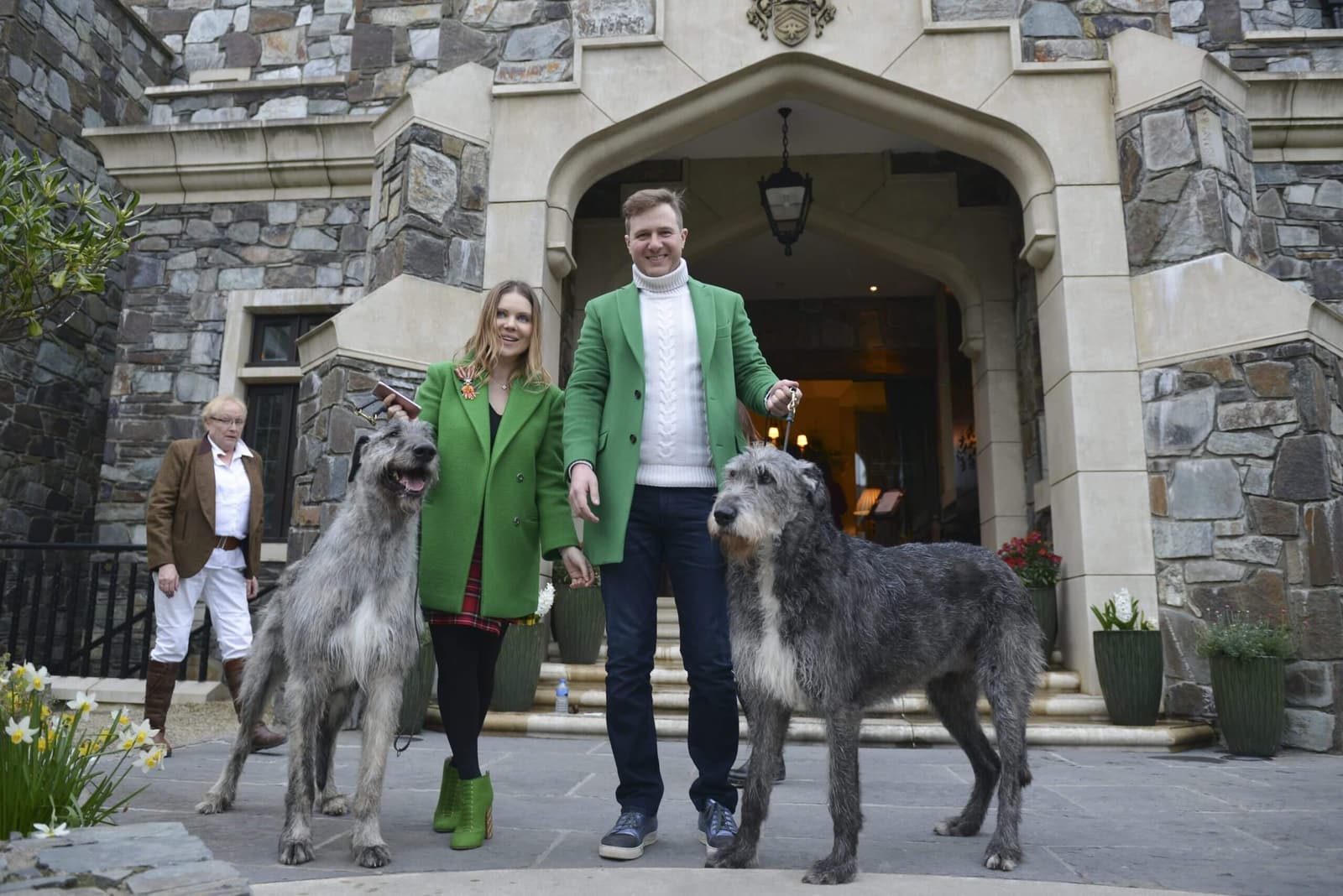 Couple With Green Jackets with Dogs'