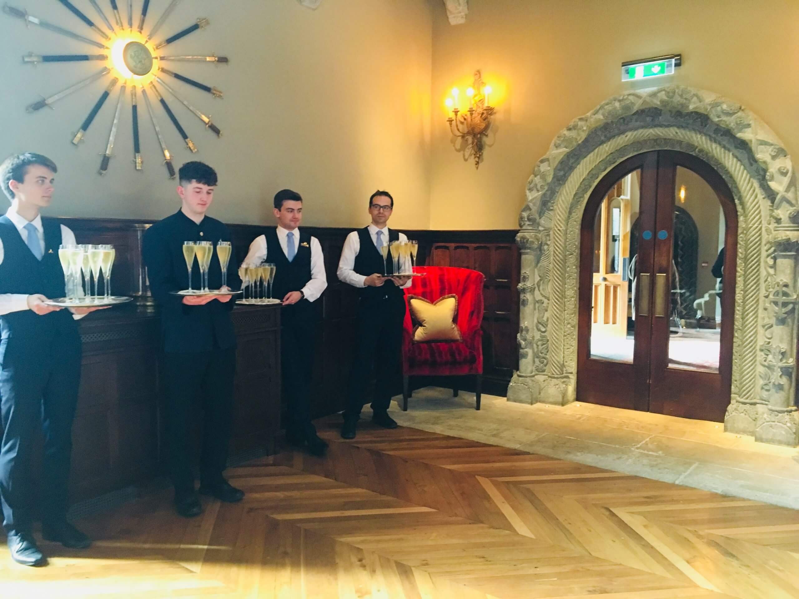 Waiters Holding Drinks